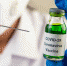 Scientists wearing masks and gloves Holding a syringe with a vaccine to prevent covid-19 - Городская Газета