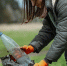 Girl volunteer collects garbage in the forest, takes care of the environment. - Городская Газета